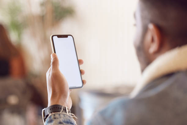 istock Shot of a man using his smartphone in a coffee shop 1359522475