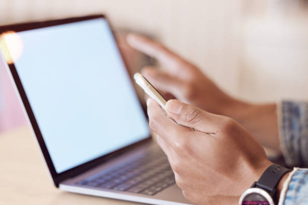 istock Shot of a man using his smartphone while working in a coffee shop 1359522507