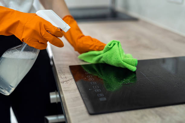 istock closeup view, female hand wearing rubber protective gloves and clean kitchen 1359524387
