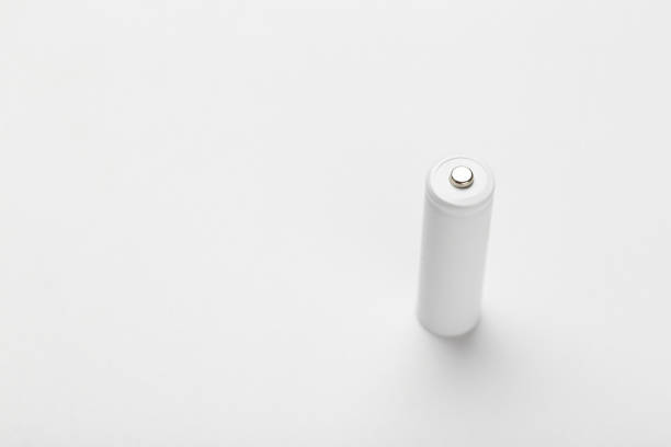istock AA size alkaline battery on a white background. Accumulator. 1359524620