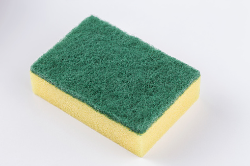 Artificial fibre sponge on a white background. Scouring pads.