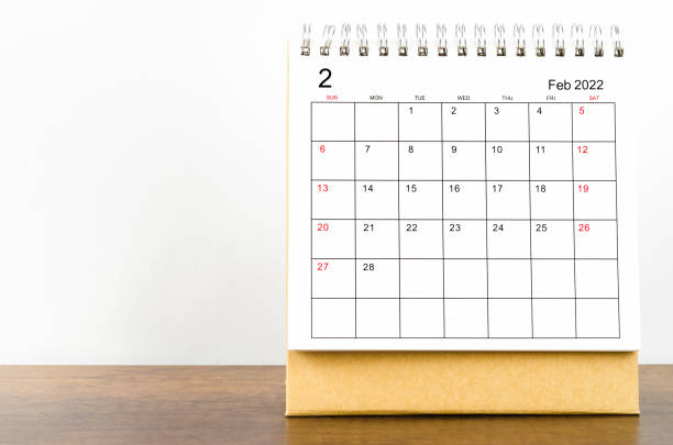 istock February 2022 desk calendar on wooden table. 1359525874
