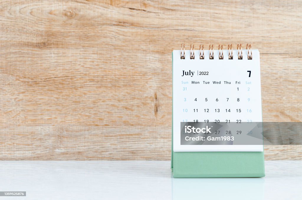 July 2022 desk calendar on white table. The July 2022 desk calendar on white table. July Stock Photo