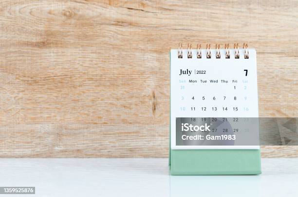 July 2022 Desk Calendar On White Table Stock Photo - Download Image Now - July, 2022, Calendar