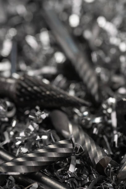 istock Engineering precision milling carbide tools on metal shavings macro blurred background 1359527079