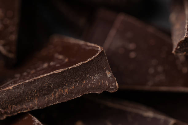 istock Dark chocolate cracked pieces closeup macro 1359528531