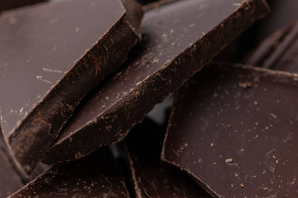 istock Dark chocolate cracked pieces closeup macro 1359528540