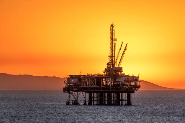Offshore oil platform at dusk stock photo