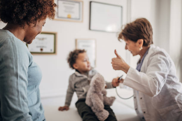istock Doctor examining little boy 1359528942