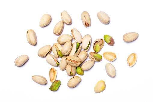 Group of Pistachio nuts isolated on white background. Top view. Flat lay.