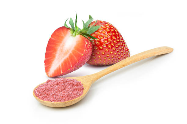 Strawberry powder Strawberry protein powder in wooden spoon and fresh strawberry fruit isolated on white background. dried fruit on white stock pictures, royalty-free photos & images