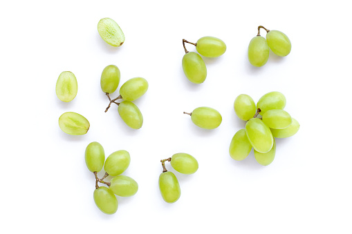 Green grapes isolated on white background. Top view. Flat lay.