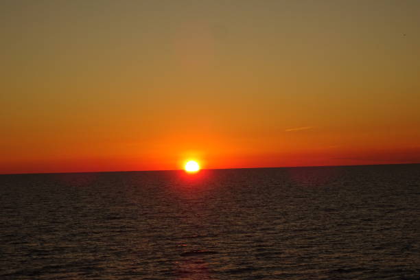 istock Sunset at the sea 1359530272