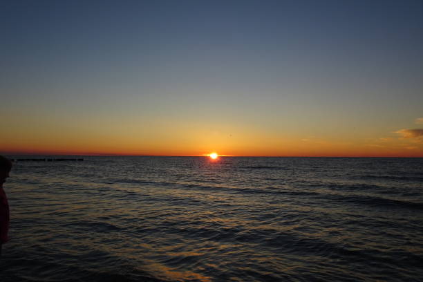 istock Sunset at the sea 1359531034