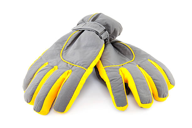Pair of colorful ski gloves over background