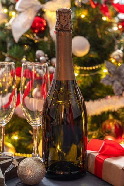 istock A bottle of champagne on a Christmas background 1359532478