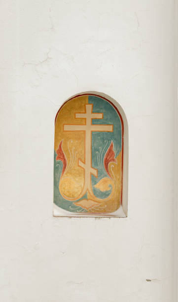 istock Orthodox cross on christian church white wall 1359532623