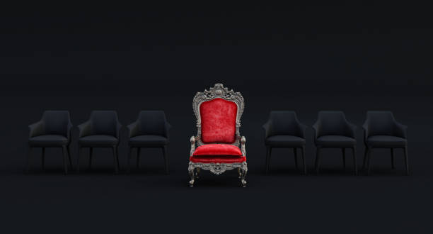 istock red royal throne with Modern black armchairs isolated on black background, Leadership concept, 1359534461