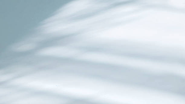 istock Light airy shadow on wall in light gray and blue tones. 1359535512