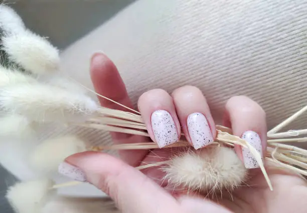 Beautiful stylish art manicure with pastel nail polish