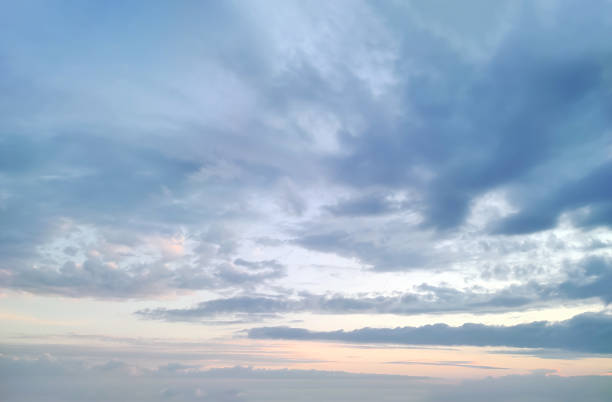 Beautiful blue and orange cloudy sky at sunset. Gradient sky color