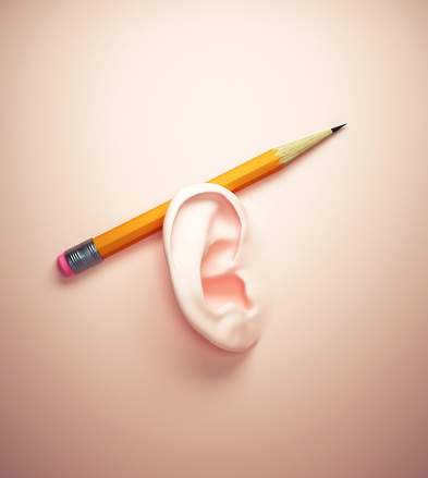 Surreal image of a ear on wall with a pencil. Project manager and focus concept. This is a 3d render illustration