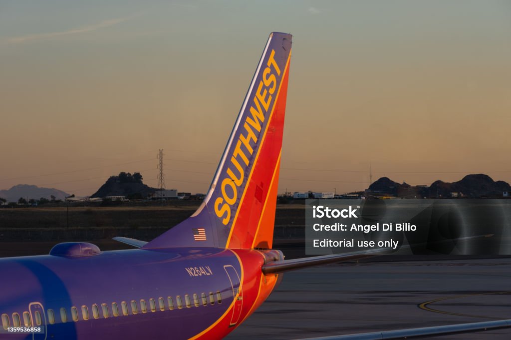 Southwest Airlines Plane Phoenix Sky Harbor International Airport, Arizona, USA - December 15, 2021: image of Southwest International Airlines Boeing 737-7H4 registration N264LV shown at a gate at dusk. Southwest Airlines Stock Photo Southwest Airlines Plane Phoenix Sky Harbor International Airport, Arizona, USA - December 15, 2021: image of Southwest International Airlines Boeing 737-7H4 registration N264LV shown at a gate at dusk. Southwest Airlines Stock Photo
