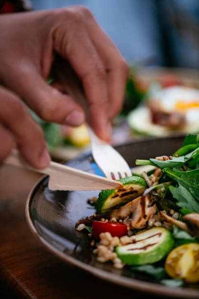 istock Eating Vegan Salad in Eco-Friendly Restaurant 1359536906
