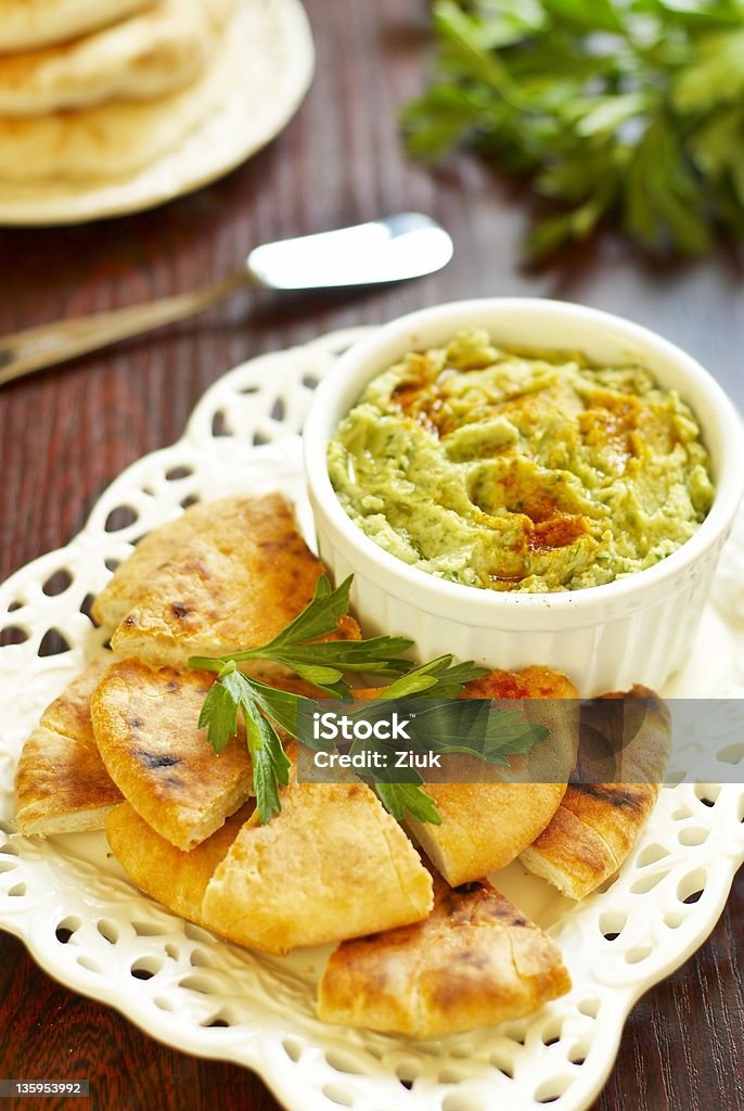 Hummus with herbs Hummus with herbs, paprika and olive oil Appetizer Stock Photo