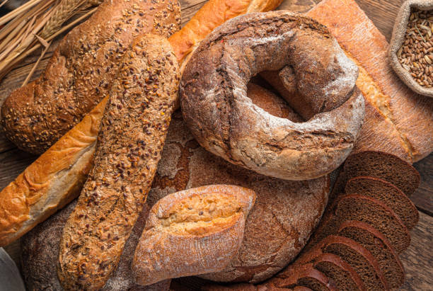 istock Bread background. Rye and wheat bread of different types 1359543135