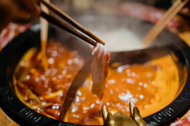 istock Sliced pork cooking in Chinese spicy hotpot 1359543874