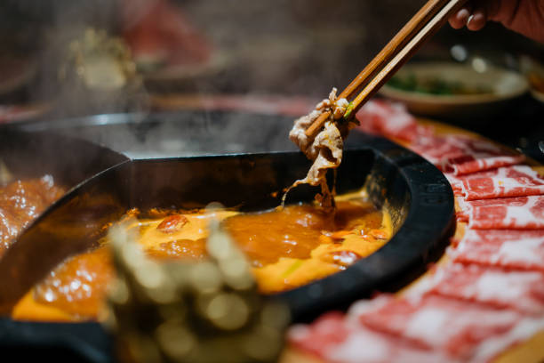 istock Cooked sliced pork in Chinese spicy hotpot 1359543881
