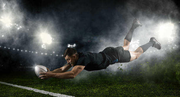 Try.  Rugby football player in action Try.  Rugby football player in action on dark arena background rugby stock pictures, royalty-free photos & images