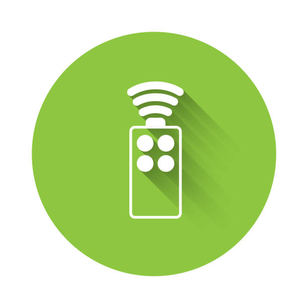 White Remote control for the camera icon isolated with long shadow. An auxiliary device that allows you to work with a camera from a distance. Green circle button. Vector White Remote control for the camera icon isolated with long shadow. An auxiliary device that allows you to work with a camera from a distance. Green circle button. Vector. long shutter speed stock illustrations