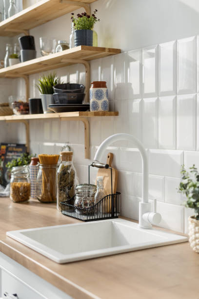 istock White sink and jars with cereals in kitchen 1359544171