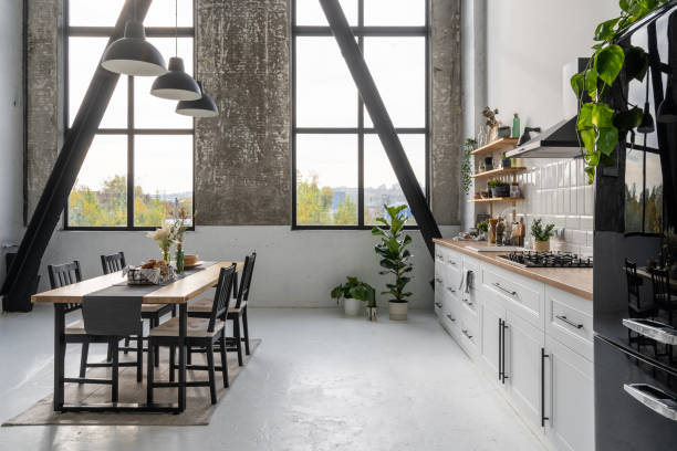 istock Spacious modern kitchen with large windows and furniture 1359544191