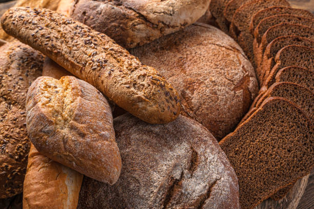 istock Assortment of fresh rye and wheat bread. Bread background 1359544206