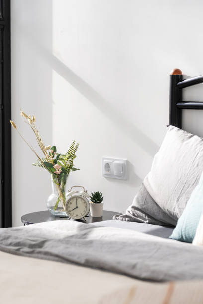 istock Home decor on nightstand in modern cozy bedroom 1359544228