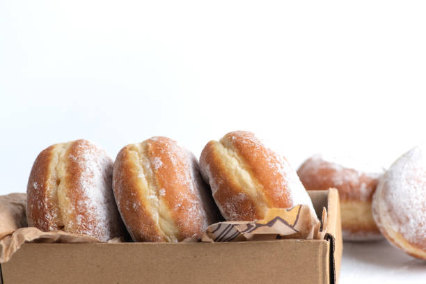 istock A few donuts filled with marmelade sprinkled with powdered sugar 1359544742