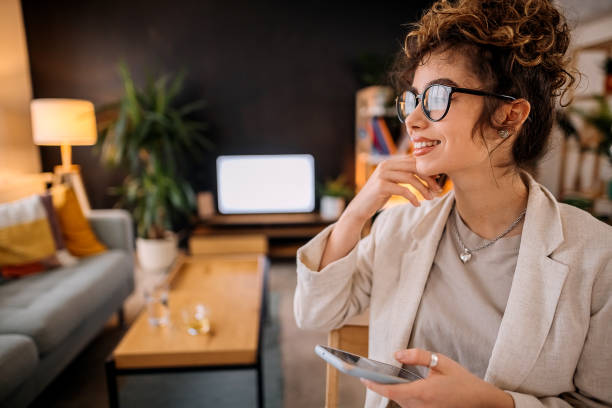 istock Woman uses a mobile phone 1359544746