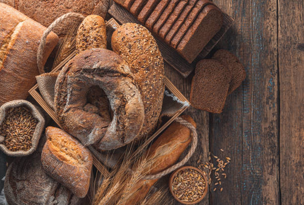istock Different types of bread on a wooden background. Bakery products 1359545427