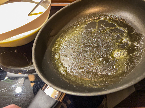 Butter in the pan for the pancake pond.