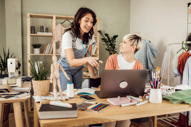 istock Two best friends running a clothing design studio together 1359546887