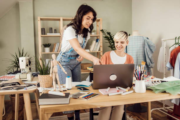 istock Tailor and a fashion designer cooperating at their workshop 1359546891