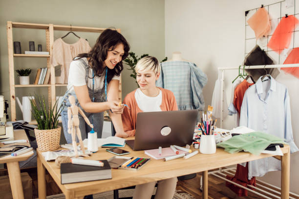 istock Two women running a small workshop for designing and making clothes 1359546896