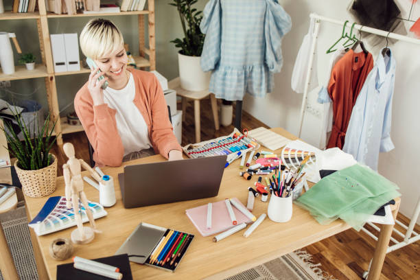 istock Young woman running a clothing design studio 1359546939