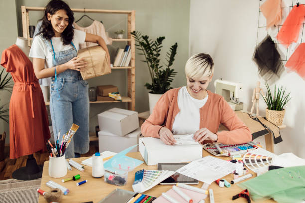 istock Two young women creating clothes by order 1359546950