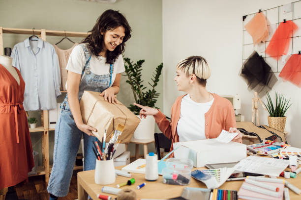 istock Two clothing designers sending packages to their customers 1359546957