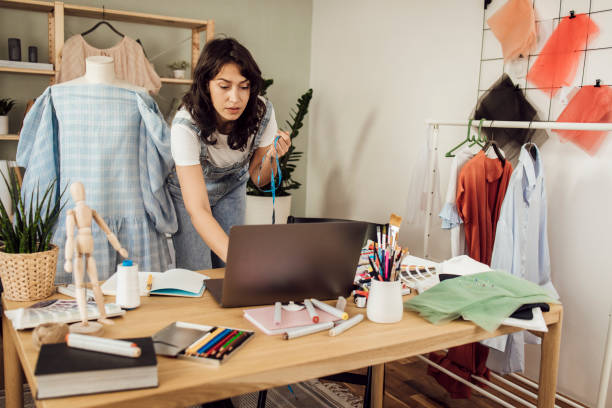 istock Young clothing designer working on a new collection 1359546984