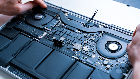 Computer maintenance. Pc technician repair service with laptop on hardware background. Maintenance engineer support. Electronic technology development concept
